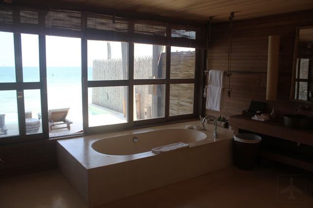 The spacious bath area with a sea view!